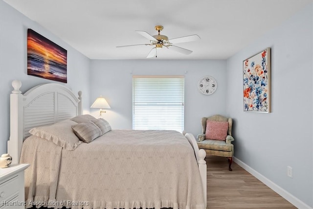 bedroom featuring light hardwood / wood-style floors and ceiling fan