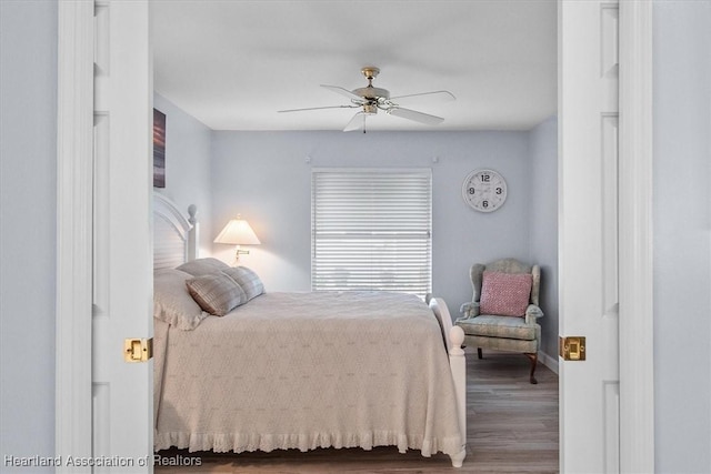 bedroom featuring wood-type flooring and ceiling fan