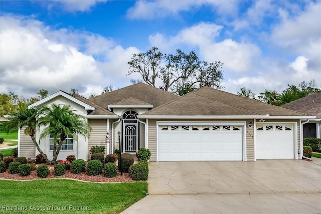 ranch-style house with a garage and a front yard