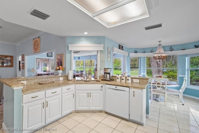 kitchen featuring dishwasher, sink, light stone counters, a notable chandelier, and white cabinets