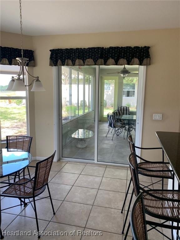 dining area with light tile patterned floors