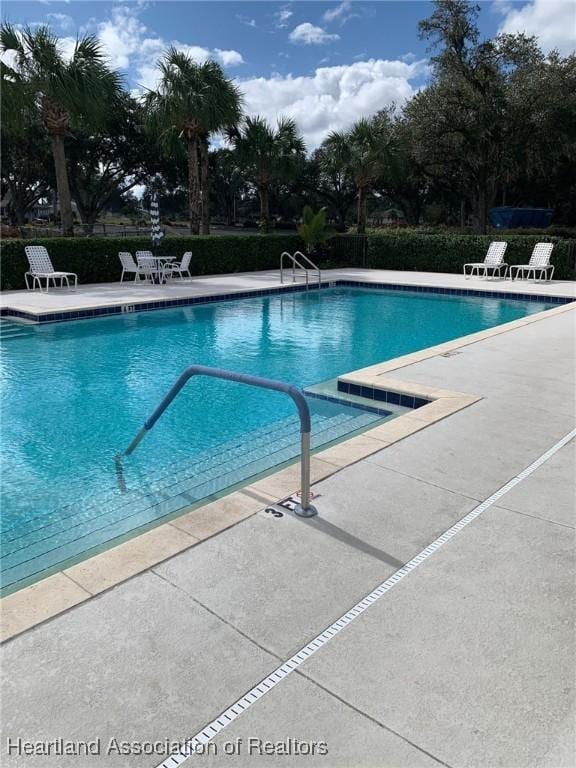 pool with a patio