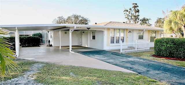 view of front of home featuring a carport