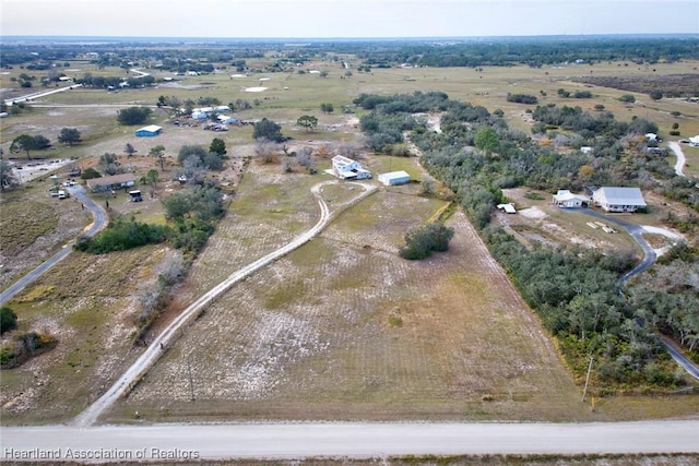 birds eye view of property featuring a rural view