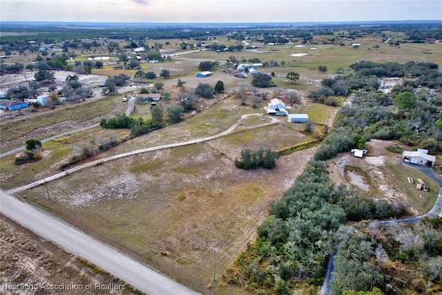 birds eye view of property featuring a rural view