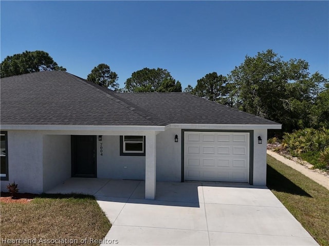 ranch-style home featuring a garage