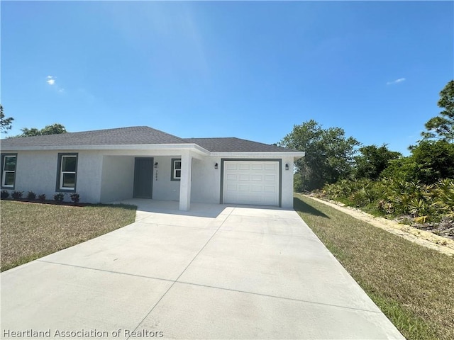 view of front facade with a front lawn and a garage