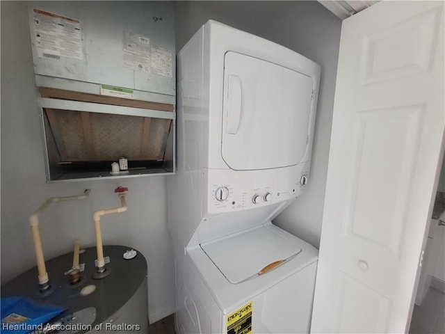 laundry room with stacked washer and clothes dryer