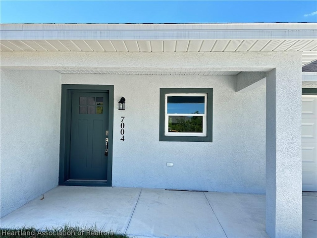 entrance to property with a porch