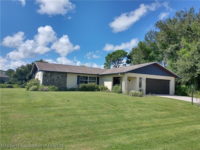 ranch-style house with a garage and a front yard