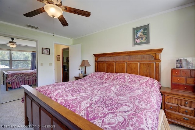 carpeted bedroom with ceiling fan and crown molding