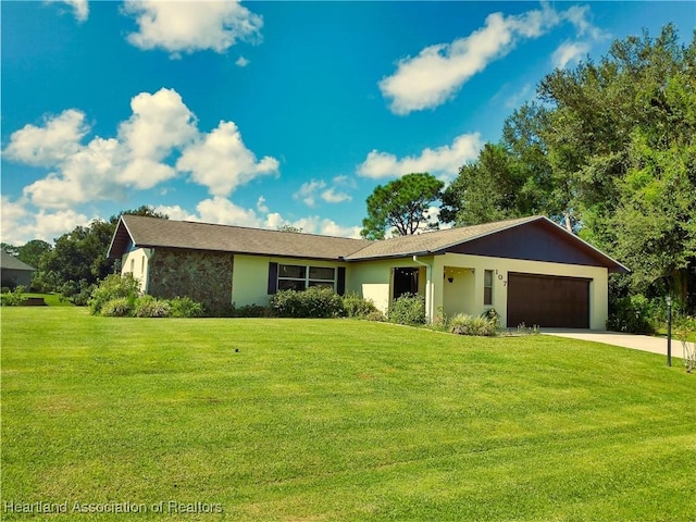 ranch-style house with a garage and a front lawn