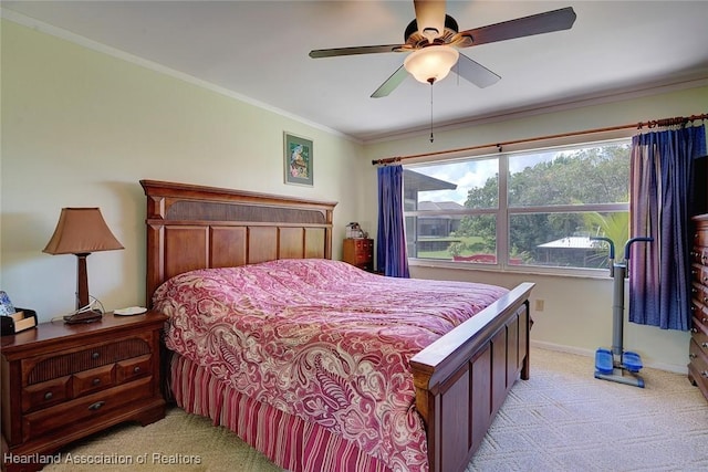 bedroom featuring light carpet, ceiling fan, and ornamental molding