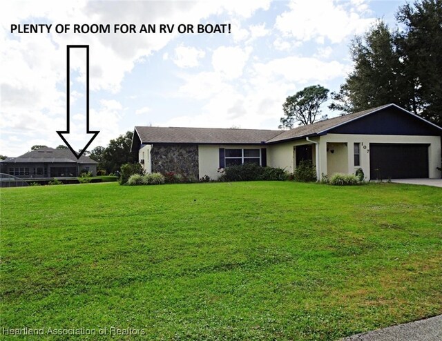 view of front of house featuring a front yard and a garage