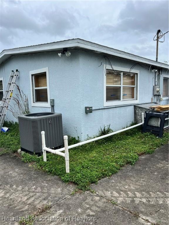 view of property exterior featuring central air condition unit