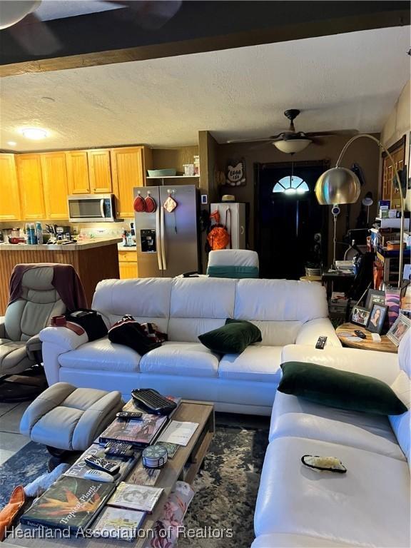 living room with ceiling fan