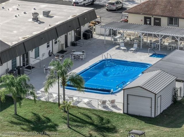 view of pool featuring a patio, a yard, and cooling unit