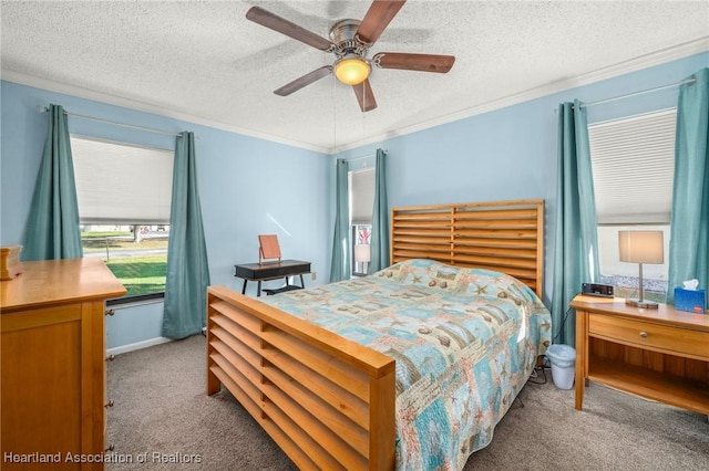 carpeted bedroom with ceiling fan, ornamental molding, and a textured ceiling