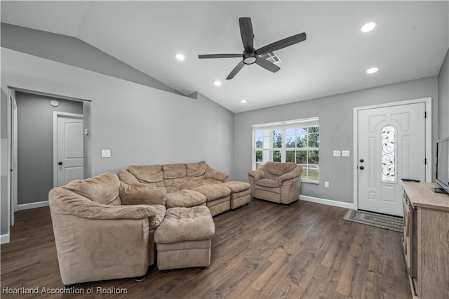 living room featuring dark wood-type flooring, ceiling fan, and vaulted ceiling