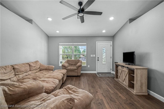 living room featuring dark hardwood / wood-style floors and ceiling fan