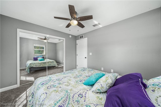 carpeted bedroom with a closet and ceiling fan