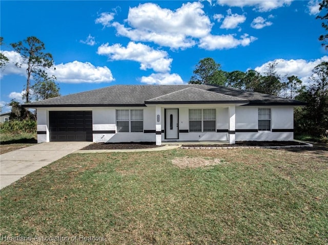 single story home with a garage and a front yard