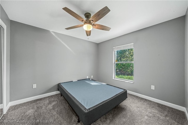 unfurnished bedroom featuring carpet and ceiling fan