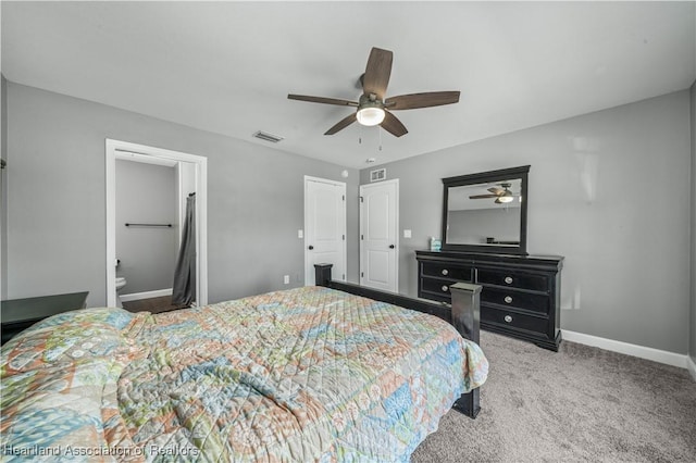 carpeted bedroom with ceiling fan and connected bathroom