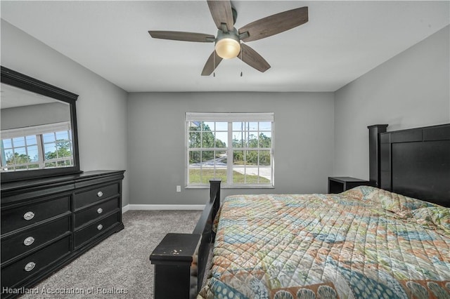 bedroom featuring light carpet and ceiling fan