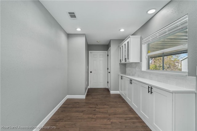 hallway featuring dark wood-type flooring