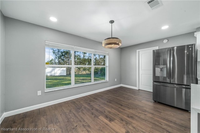 kitchen with stainless steel refrigerator with ice dispenser and dark hardwood / wood-style flooring