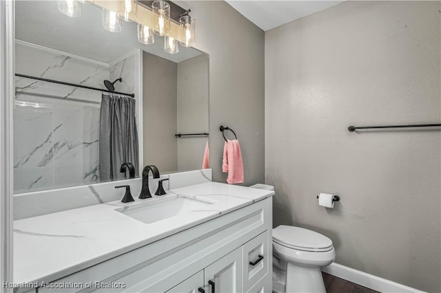 bathroom with walk in shower, vanity, toilet, and hardwood / wood-style flooring