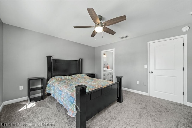 bedroom with carpet flooring, connected bathroom, and ceiling fan