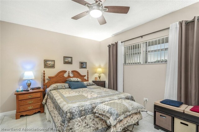 tiled bedroom with ceiling fan