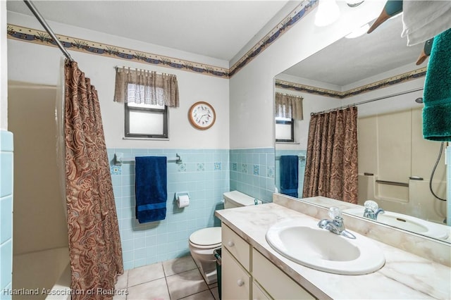 full bathroom with vanity, tile patterned floors, toilet, shower / bathtub combination with curtain, and tile walls