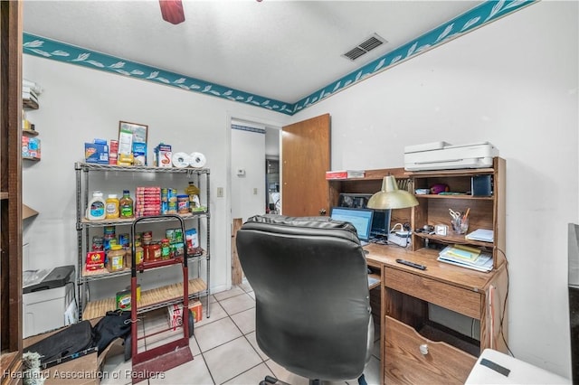 office featuring light tile patterned floors and ceiling fan