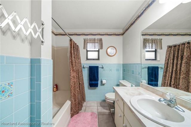 full bathroom featuring vanity, tile patterned flooring, toilet, shower / bathtub combination with curtain, and tile walls