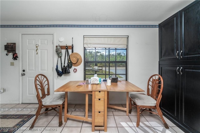 dining area with light tile patterned flooring