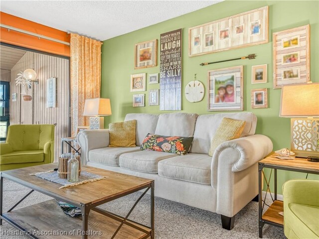5514 Matanzas Dr, Sebring, FL 33872 - carpeted living room featuring a textured ceiling