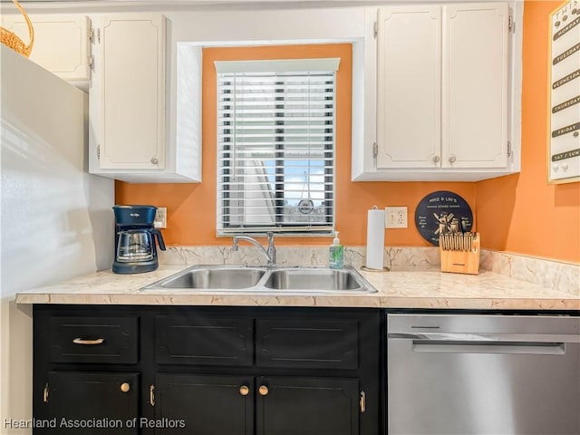 5514 Matanzas Dr, Sebring, FL 33872 - kitchen with white cabinetry, sink, and stainless steel dishwasher