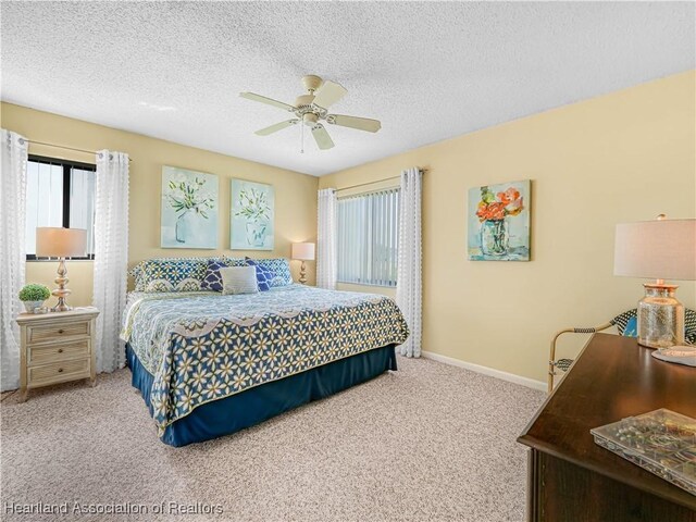 5514 Matanzas Dr, Sebring, FL 33872 - carpeted bedroom with ceiling fan and a textured ceiling