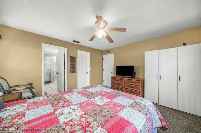 carpeted bedroom with ceiling fan and connected bathroom