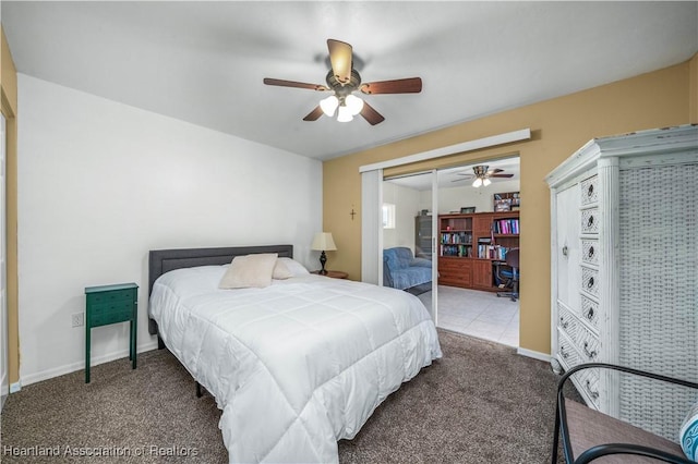 bedroom featuring ceiling fan and carpet