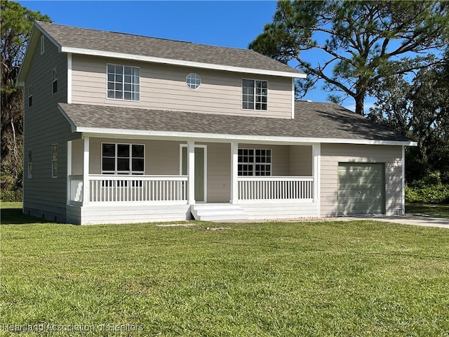 view of front of home with a front lawn, covered porch, and a garage