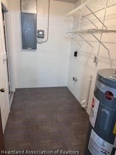 laundry room with electric water heater and electric panel