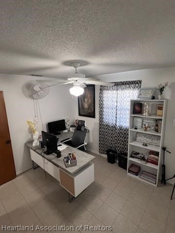 office space featuring a textured ceiling and ceiling fan