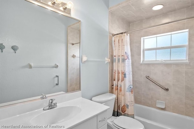 full bathroom featuring vanity, shower / tub combo, and toilet