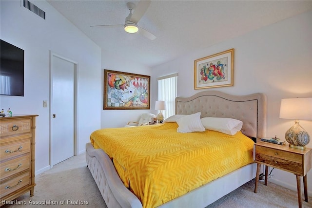 bedroom with ceiling fan, visible vents, and light carpet