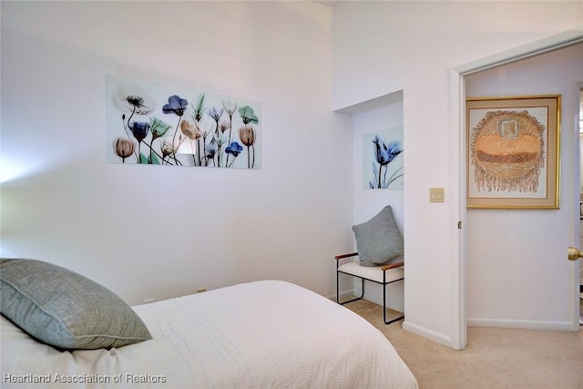 carpeted bedroom with baseboards