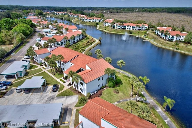 birds eye view of property featuring a residential view and a water view